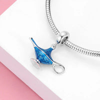 Blue and silver Aladdin’s lamp charm.