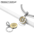 Round, jeweled, hinged pendant.