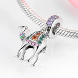 Silver camel charm with colorful gemstones.
