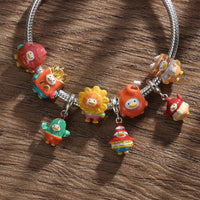 Charm bracelet with cartoon character pendants.