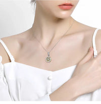 Necklace with a circular pendant.