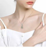 Necklace with a circular pendant.