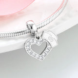 Silver heart and nurse cap charm.