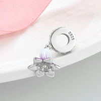 Silver flower charm.