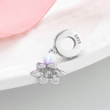 Silver flower charm.