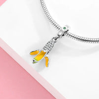 Banana charm with silver accents.