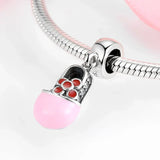 Pink baby shoe charm.