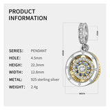 Silver and gold pendant with embedded gems.