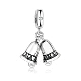 Silver charm with two hanging bells.