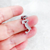 Italy-shaped charm with heart cutout.