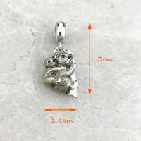 Silver koala charm.