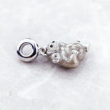 Silver monkey charm.