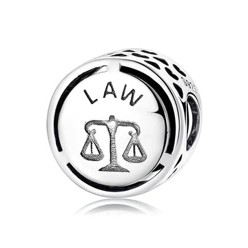 Silver law-themed charm.