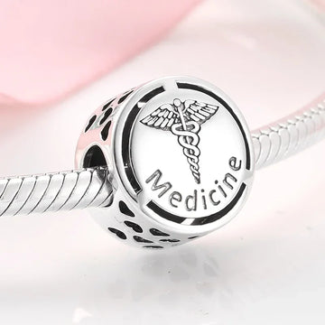 Silver medicine charm.