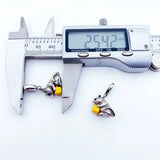 Silver mouse charm with yellow cheese.