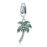 Silver palm tree charm with green stones.