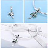 Silver palm tree charm.