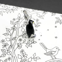 Black and white penguin charm.