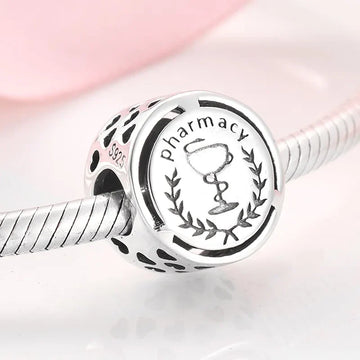 Silver pharmacy charm.