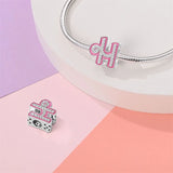 Pink and silver Libra charm.