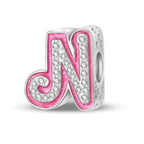 Pink and silver letter ’N’ charm.