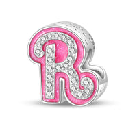 Pink and silver letter ’R’ charm.