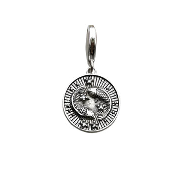 Silver pendant with intertwined snakes.