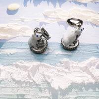 Two polar bear charms.