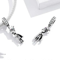 Silver prince charm pendants.