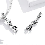 Silver prince charm pendants.