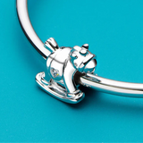 Silver rocking horse charm.
