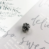 Silver rose charm.