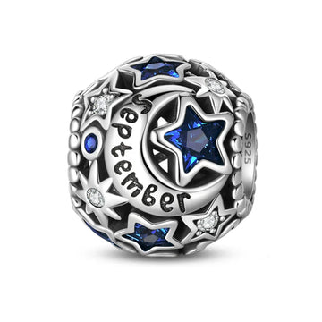 Silver charm with stars and ’September’ inscription.