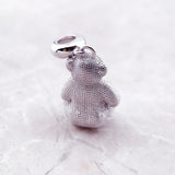 Silver teddy bear charm.