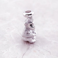 Silver monkey charm.