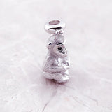 Silver monkey charm.