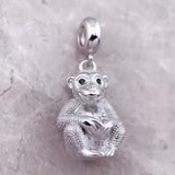 Silver monkey charm.
