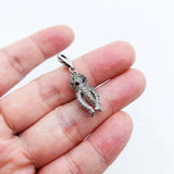 Silver octopus charm.