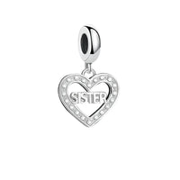 Silver heart charm with ’Sister’ inscription.