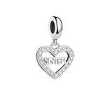 Silver heart charm with ’Sister’ inscription.