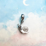 Silver snail charm.