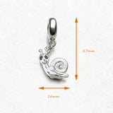 Silver snail charm.