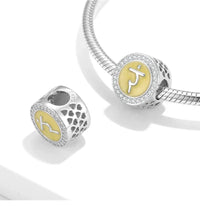 Silver and yellow chakra charm.