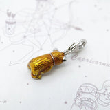 Golden bear charm.
