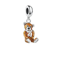Teddy bear charm.