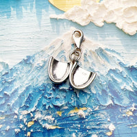 Open silver locket charm.
