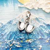 Open silver locket charm.
