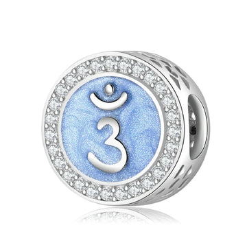 Blue chakra charm with crystal accents.