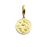 Gold pendant with a woman’s face and star accents.