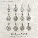 Silver zodiac sign pendants.